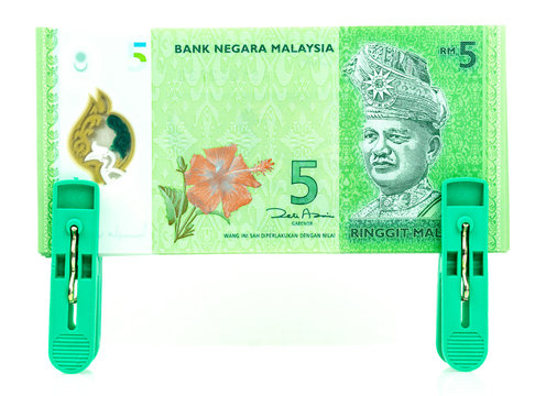 Five Malaysia Ringgit Currency Bank Notes on Pinchers