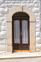 Fototapeta premium Wooden door. Minervino Murge. Puglia. Italy.