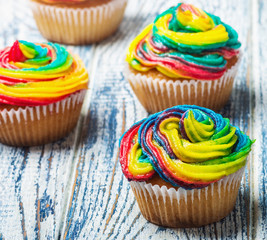 cupcakes covered with colored cream