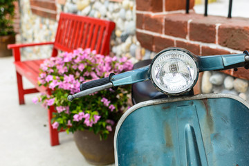 classic motorcycle with red bench