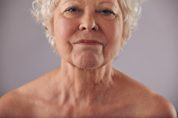 Mature woman face with wrinkled skin