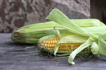 Sweet corn on wooden background