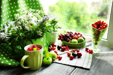 Still life with berries and flowers