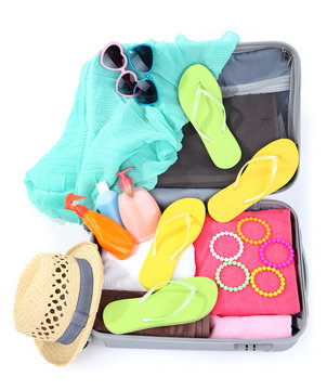 Suitcase with things for travelling somewhere close to water