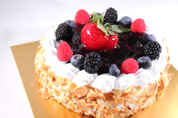 blueberry cheese cake on a tiny plate, the topping is strawberr