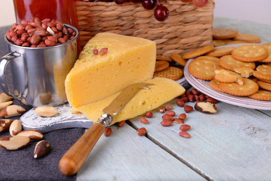 Cheese and crackers on wooden table close-up