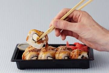 hands sticks japan rolls