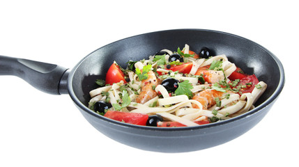 Fresh prawns with spaghetti and vegetables in a pan