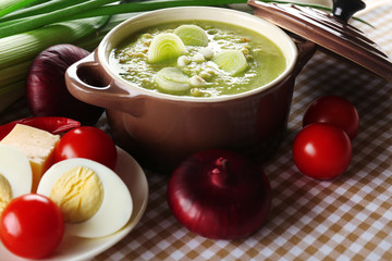 Leek soup on table, close up