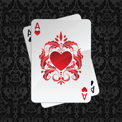 two aces playing cards on black damask pattern(hearts)