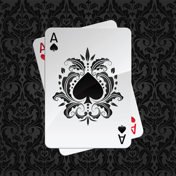 two aces playing cards on black damask pattern(spades)