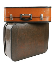 Vintage old travel suitcases, isolated on white