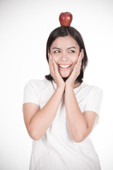 Smiling woman with apple isolated on white