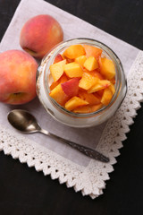Healthy breakfast - yogurt with  fresh peach and muesli served