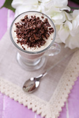 Yogurt, with chocolate cream, chopped chocolate and muesli
