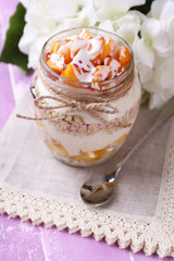 Healthy breakfast - yogurt with  fresh peach and muesli served
