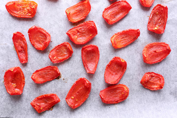 Sun dried tomatoes on drying tray, close-up