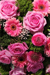 Ranunculus, roses and gerberas in a wedding arrangement