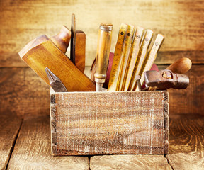 old tools in a wooden box