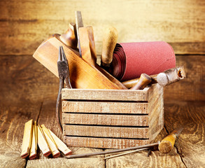 old tools in a wooden box