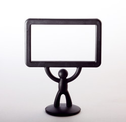 plastic figurine of a man with a placard on white background