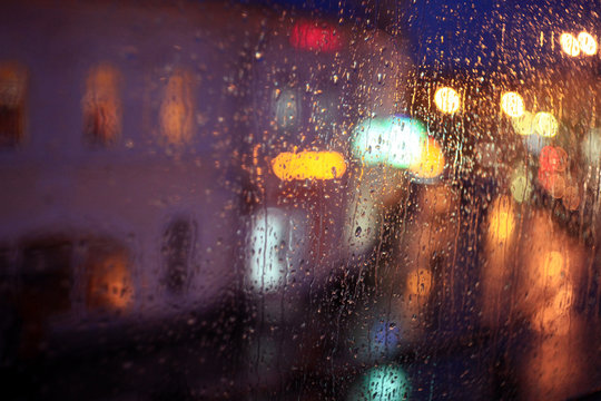 Window Rain Blurred City Lights