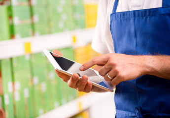 Sales clerk using tablet