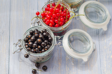 colorful currant fruit jars wooden table