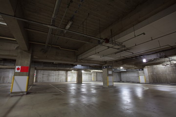 Parking garage underground interior, neon lights in dark