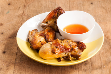 Grilled chicken on dish.