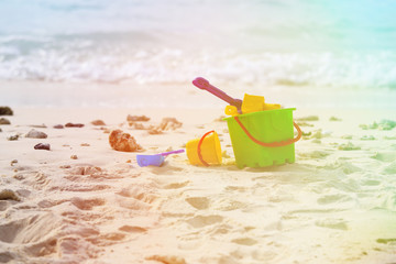 kids toys on tropical sand beach