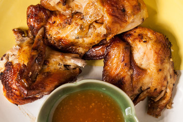 Grilled chicken on dish.