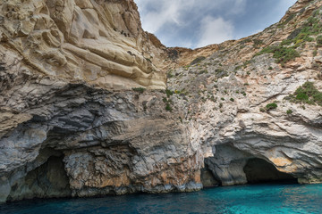 Fototapeta na wymiar Caves and cliffs at the coast of Gozo Island