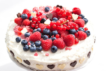 Homemade creamy cake decorated with fresh berries