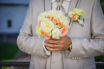 Groom with wedding bouquet