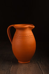 Vintage ceramic pot on wooden table