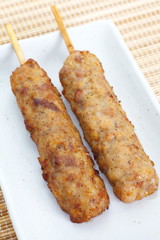 Deep fried chicken  knees tendon with skewer