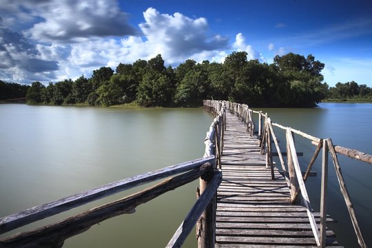 Wooden bridge crossover reservoir southern of Thailand