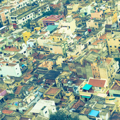 retro style  image of colorful homes in crowded Indian city Tri