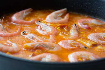 Cooking of traditional spanish seafood paella
