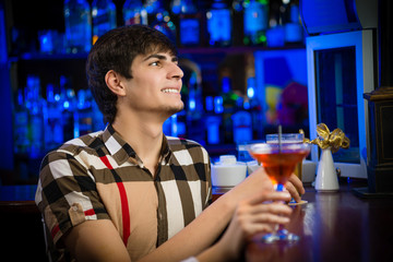 portrait of a young man at the bar