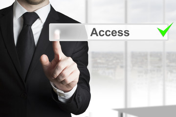 businessman pushing button access