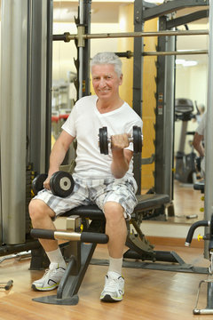 Elderly man in a gym.