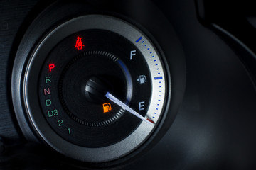 Fuel gauge empty close up at night