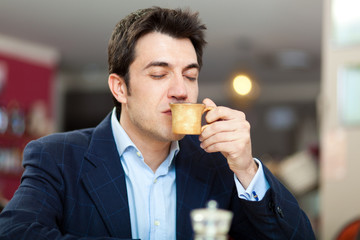 Man having a coffee at the restaurant