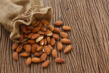 Almonds on wooden background