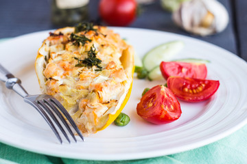 stuffed zucchini with chicken and vegetables, horizontally, fork