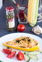 stuffed zucchini with chicken and vegetables, vertically, yellow
