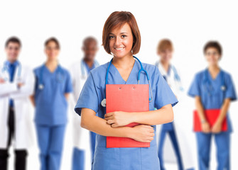 Nurse in front of a group of medical workers