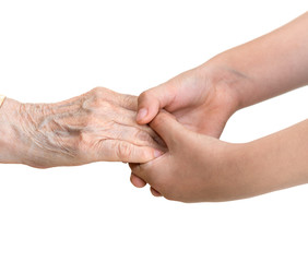 Senior woman and young girl  holding hands